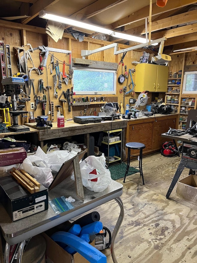 2485 Keyes Is, International Falls, MN 56649 - misc room with a workshop area, unfinished concrete floors, and wooden walls