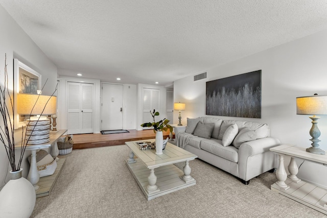 3412 Oak Ridge Rd Unit 208, Minnetonka, MN 55305 - living area featuring a textured ceiling, recessed lighting, and carpet