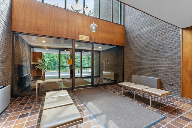 3412 Oak Ridge Rd Unit 208, Minnetonka, MN 55305 - lobby with a high ceiling and brick wall