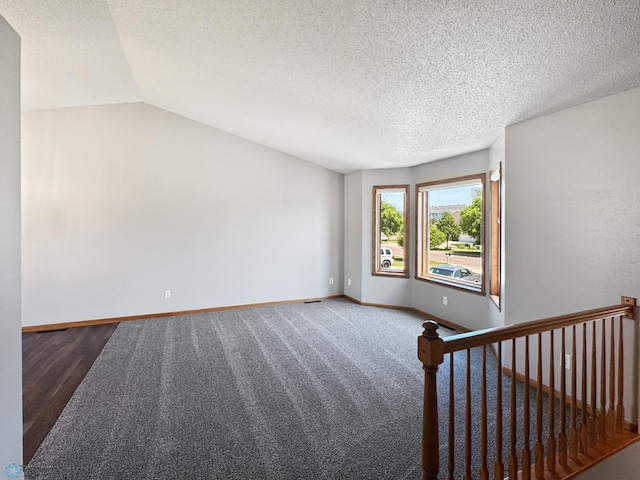 3337 Monroe St S, Fargo, ND 58104 - empty room featuring lofted ceiling and a textured ceiling