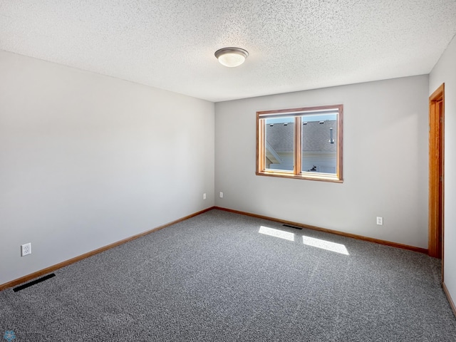 3337 Monroe St S, Fargo, ND 58104 - unfurnished room featuring carpet floors and a textured ceiling