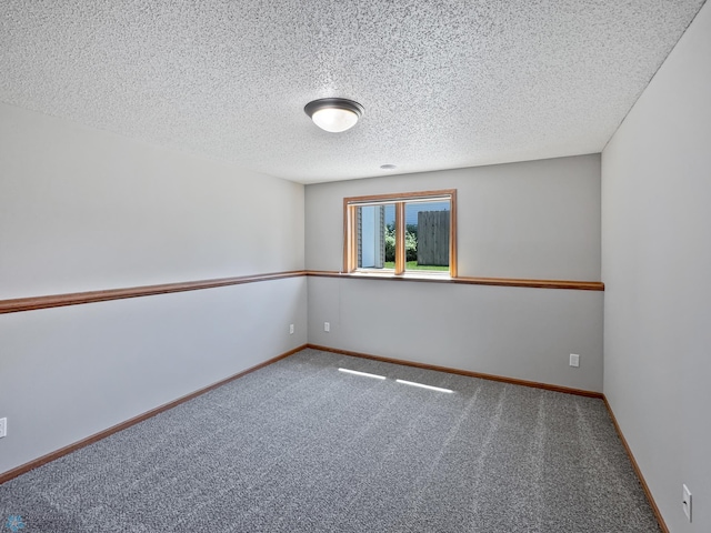3337 Monroe St S, Fargo, ND 58104 - spare room featuring carpet floors and a textured ceiling