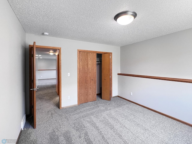 3337 Monroe St S, Fargo, ND 58104 - unfurnished bedroom with a textured ceiling, carpet, and a closet