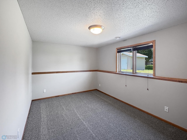3337 Monroe St S, Fargo, ND 58104 - spare room with carpet floors and a textured ceiling