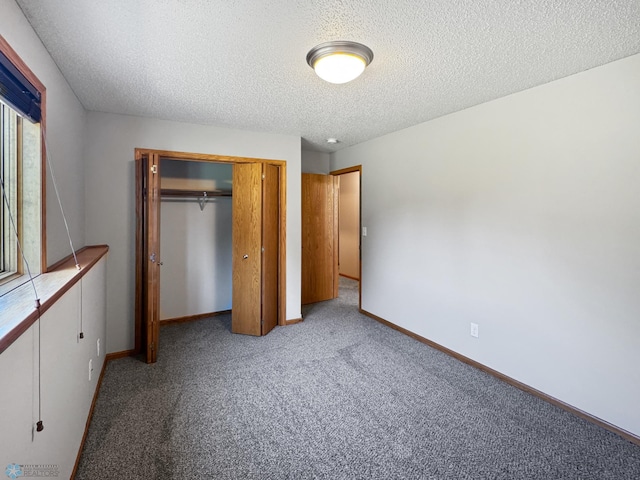 3337 Monroe St S, Fargo, ND 58104 - unfurnished bedroom featuring carpet flooring, a closet, and a textured ceiling