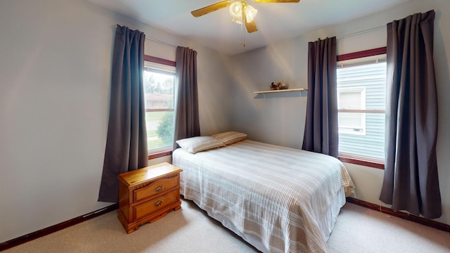 711 5th Ave SW, Austin, MN 55912 - bedroom with light carpet and ceiling fan