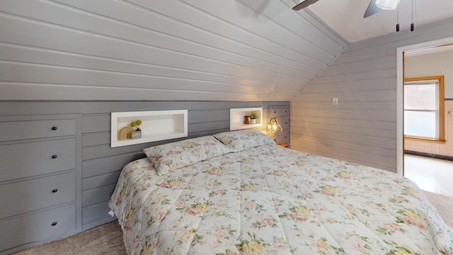 711 5th Ave SW, Austin, MN 55912 - bedroom with carpet flooring, lofted ceiling, wooden walls, and a ceiling fan