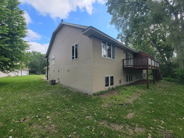 2729 Parkhaven Ct N, Brooklyn Park, MN 55444 - view of home's exterior featuring a wooden deck, a lawn, and stairway