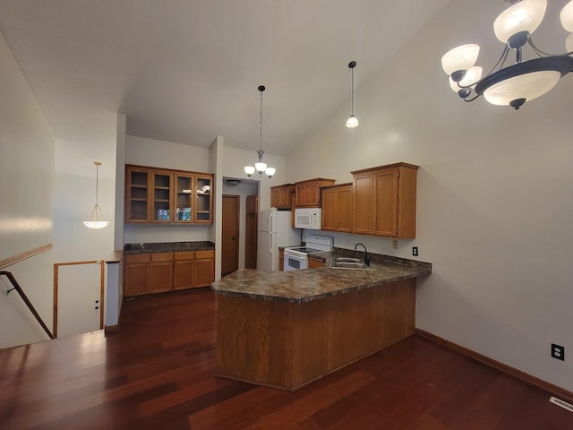 2729 Parkhaven Ct N, Brooklyn Park, MN 55444 - kitchen with white appliances, a chandelier, brown cabinets, a peninsula, and dark countertops