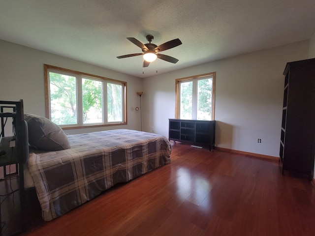 2729 Parkhaven Ct N, Brooklyn Park, MN 55444 - bedroom with wood finished floors and a ceiling fan