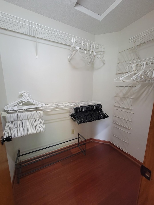 2729 Parkhaven Ct N, Brooklyn Park, MN 55444 - spacious closet featuring wood finished floors