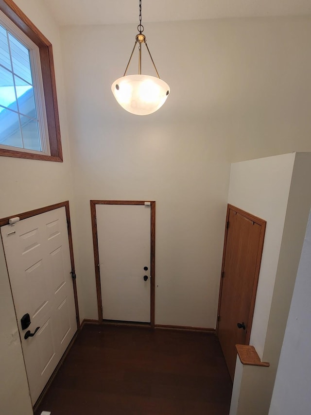 2729 Parkhaven Ct N, Brooklyn Park, MN 55444 - doorway with dark wood-style flooring and baseboards