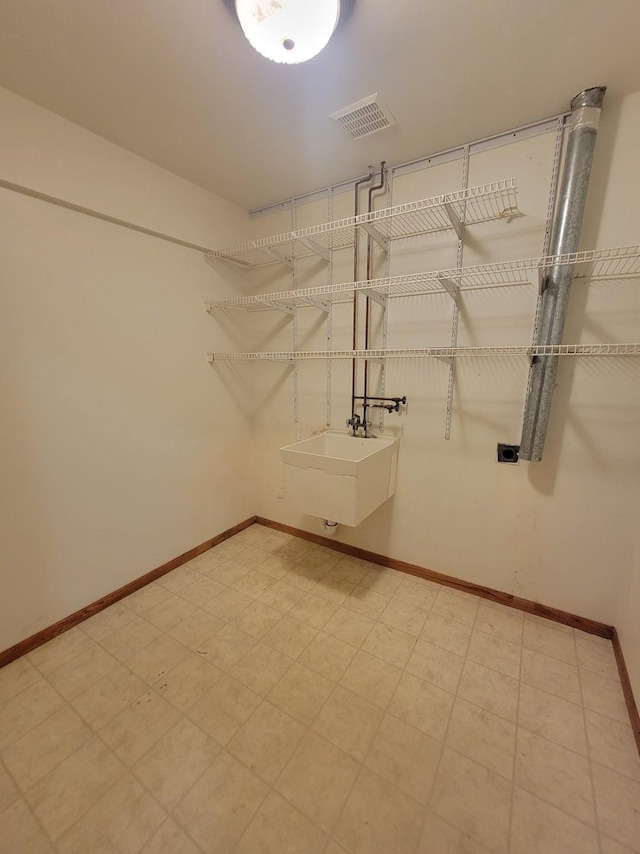 2729 Parkhaven Ct N, Brooklyn Park, MN 55444 - walk in closet featuring a sink and light flooring