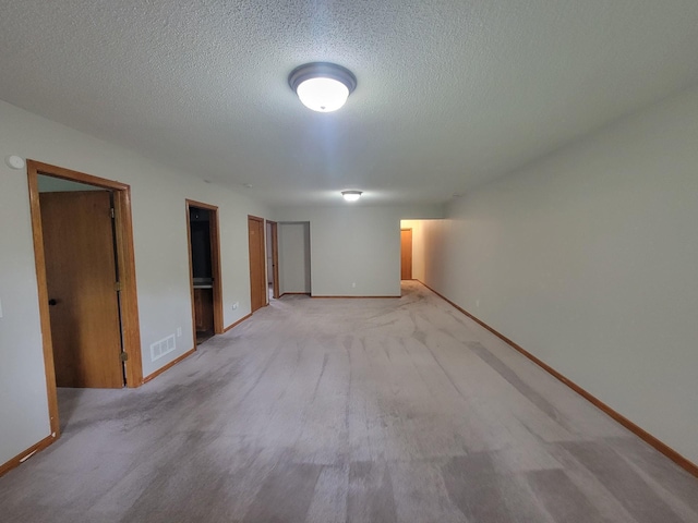 2729 Parkhaven Ct N, Brooklyn Park, MN 55444 - unfurnished room with a textured ceiling and light carpet