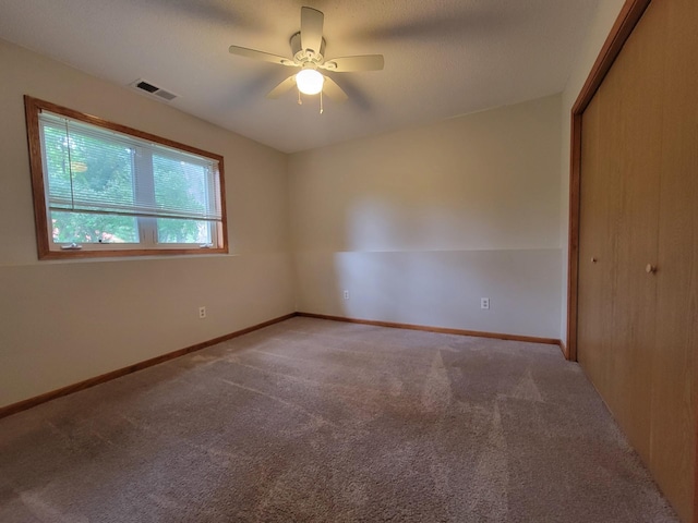 2729 Parkhaven Ct N, Brooklyn Park, MN 55444 - carpeted spare room featuring a ceiling fan and baseboards