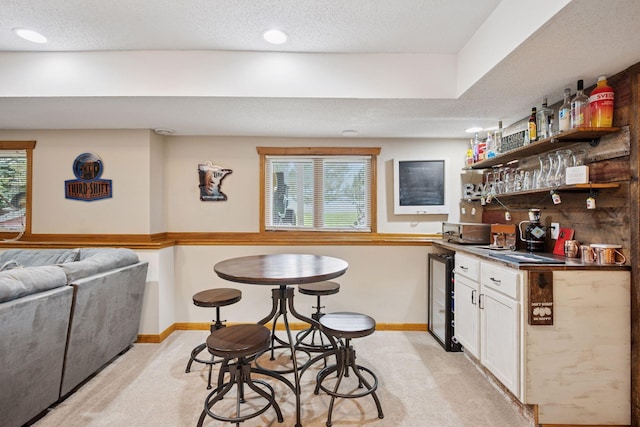 420 Pleasant Crest Cir, Annandale, MN 55302 - indoor wet bar featuring light carpet, wine cooler, a textured ceiling, and recessed lighting