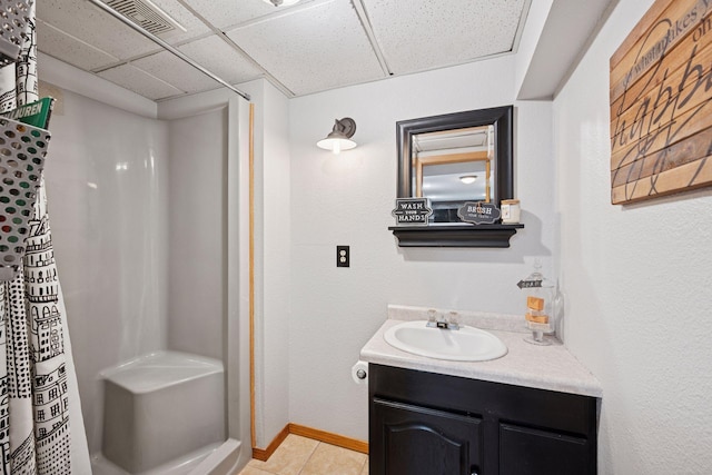 420 Pleasant Crest Cir, Annandale, MN 55302 - bathroom with a drop ceiling, vanity, a shower with curtain, and tile patterned flooring