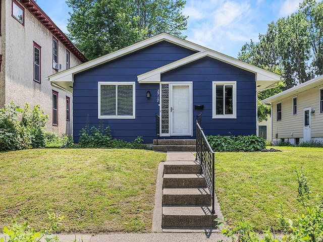 2717 22nd St, Minneapolis, MN 55406 - view of front of home with a front lawn and entry steps