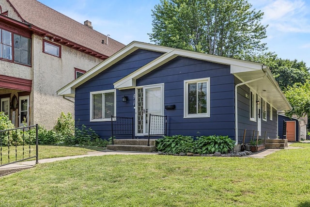 2717 22nd St, Minneapolis, MN 55406 - view of front of home with a front yard and a chimney