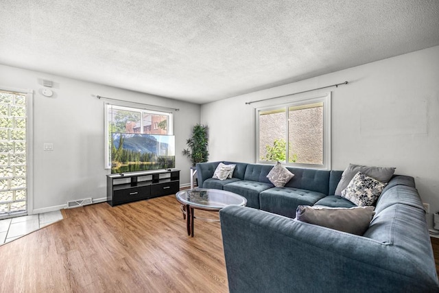 2717 22nd St, Minneapolis, MN 55406 - living area featuring a textured ceiling and wood finished floors