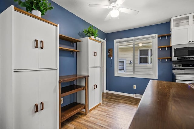 2717 22nd St, Minneapolis, MN 55406 - kitchen featuring open shelves, stainless steel microwave, wood finished floors, ceiling fan, and white cabinets