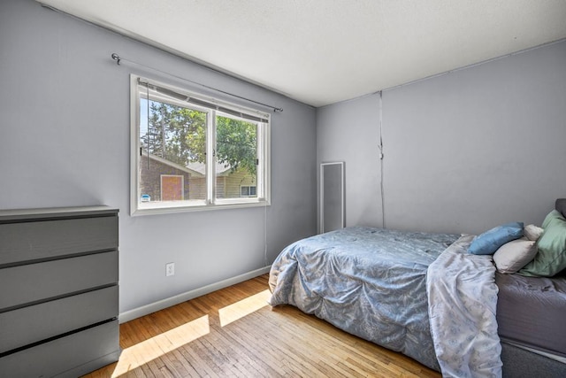 2717 22nd St, Minneapolis, MN 55406 - bedroom with hardwood / wood-style floors and baseboards