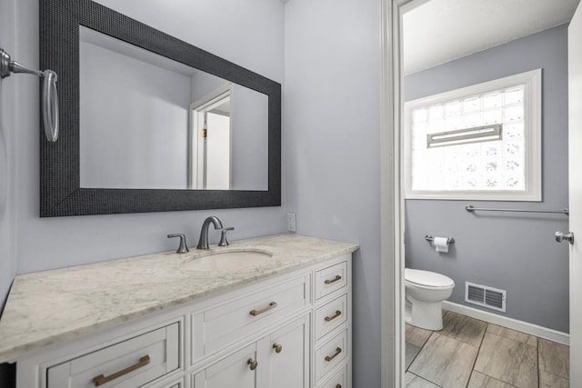 2717 22nd St, Minneapolis, MN 55406 - bathroom featuring vanity and toilet