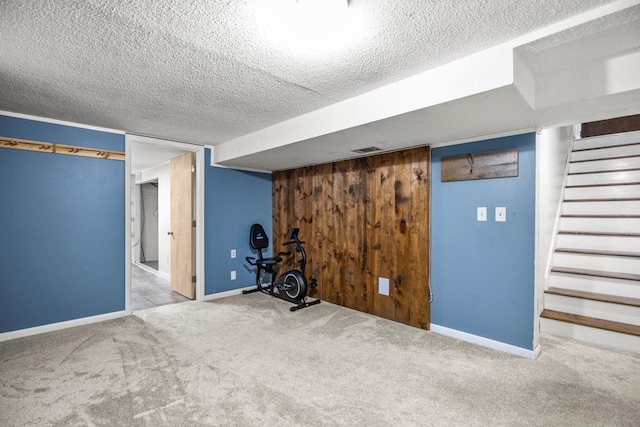 2717 22nd St, Minneapolis, MN 55406 - finished below grade area with carpet, a textured ceiling, and stairway