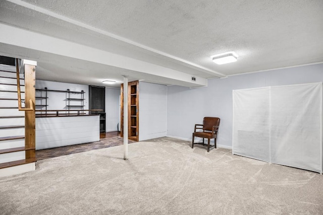 2717 22nd St, Minneapolis, MN 55406 - finished below grade area featuring a textured ceiling, carpet flooring, and stairs