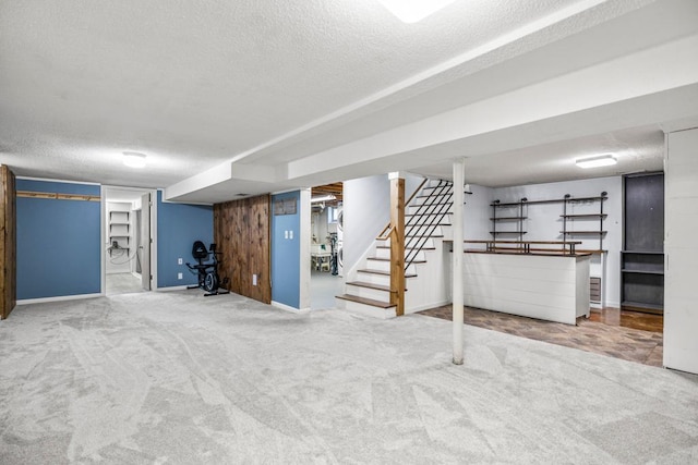 2717 22nd St, Minneapolis, MN 55406 - finished below grade area featuring a textured ceiling, stairway, and carpet floors