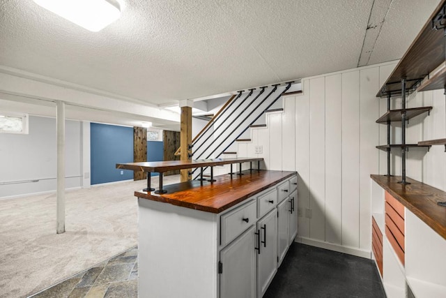 2717 22nd St, Minneapolis, MN 55406 - basement featuring stairs and a textured ceiling
