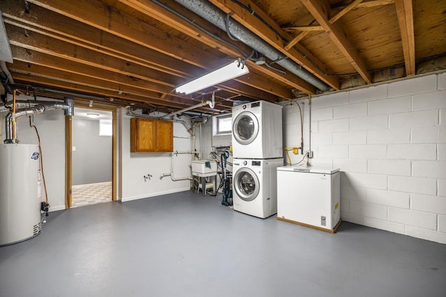 2717 22nd St, Minneapolis, MN 55406 - below grade area featuring stacked washing machine and dryer, gas water heater, white fridge, and concrete block wall