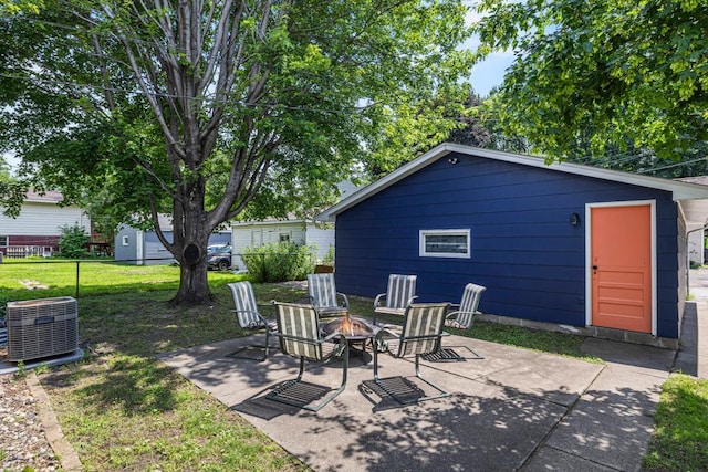 2717 22nd St, Minneapolis, MN 55406 - view of patio featuring a fire pit and an outbuilding