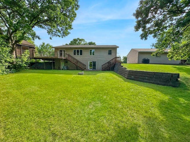2117 Isleview Rd, Grand Rapids, MN 55744 - view of green lawn with stairway and a deck