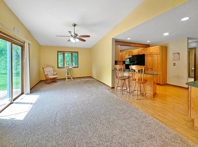 2117 Isleview Rd, Grand Rapids, MN 55744 - unfurnished living room featuring ceiling fan, a textured ceiling, light wood-type flooring, recessed lighting, and light colored carpet