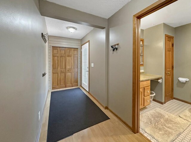 2117 Isleview Rd, Grand Rapids, MN 55744 - foyer with a textured ceiling and light wood-style floors