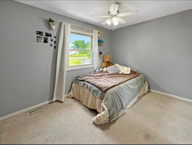 2117 Isleview Rd, Grand Rapids, MN 55744 - carpeted bedroom with a textured ceiling and ceiling fan