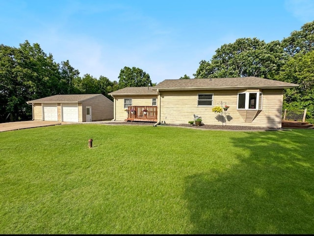 2117 Isleview Rd, Grand Rapids, MN 55744 - view of front of house featuring a garage, an outbuilding, a front yard, and a deck