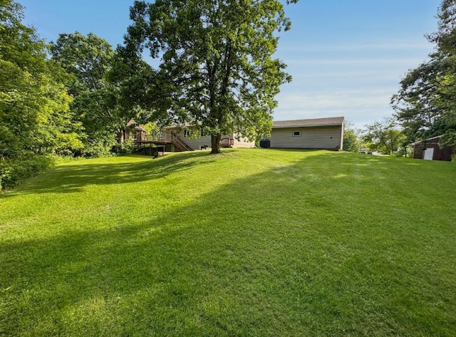 2117 Isleview Rd, Grand Rapids, MN 55744 - view of grassy yard featuring stairway and a deck