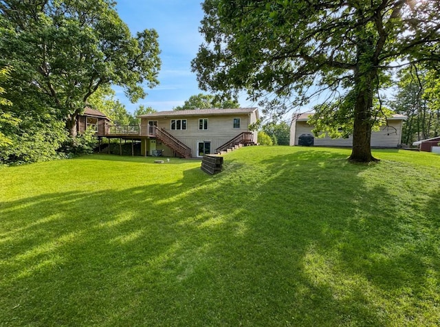 2117 Isleview Rd, Grand Rapids, MN 55744 - view of grassy yard with stairs and a deck
