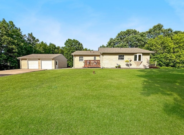 2117 Isleview Rd, Grand Rapids, MN 55744 - single story home featuring a detached garage, an outbuilding, a front yard, and a wooden deck