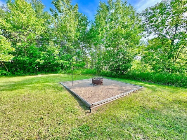 2117 Isleview Rd, Grand Rapids, MN 55744 - view of green lawn with a fire pit