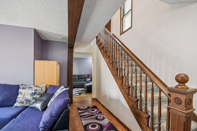 6429 Maple St, North Branch, MN 55056 - staircase with wood finished floors and a textured ceiling