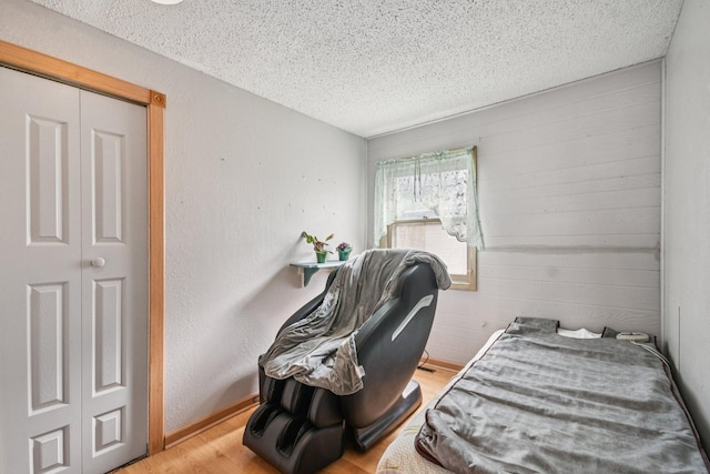 6429 Maple St, North Branch, MN 55056 - bedroom with a textured ceiling and wood finished floors