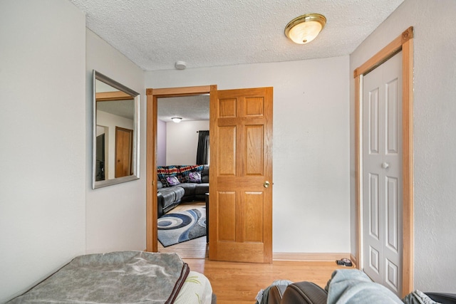 6429 Maple St, North Branch, MN 55056 - bedroom featuring wood finished floors and a textured ceiling