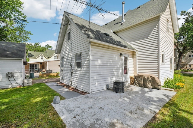 6429 Maple St, North Branch, MN 55056 - back of house with a patio area, a yard, and roof with shingles