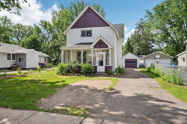 6429 Maple St, North Branch, MN 55056 - victorian-style house featuring a detached garage, an outbuilding, and driveway