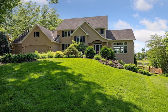 180 Ranchview Ln S, Minnetonka, MN 55391 - view of front of property with stucco siding and an attached garage