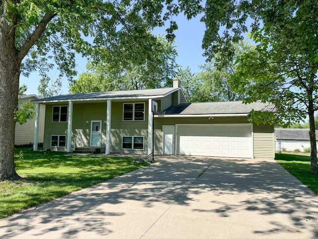 45 3rd Ave NW, Rice, MN 56367 - view of front facade with an attached garage, driveway, a front lawn, and a chimney