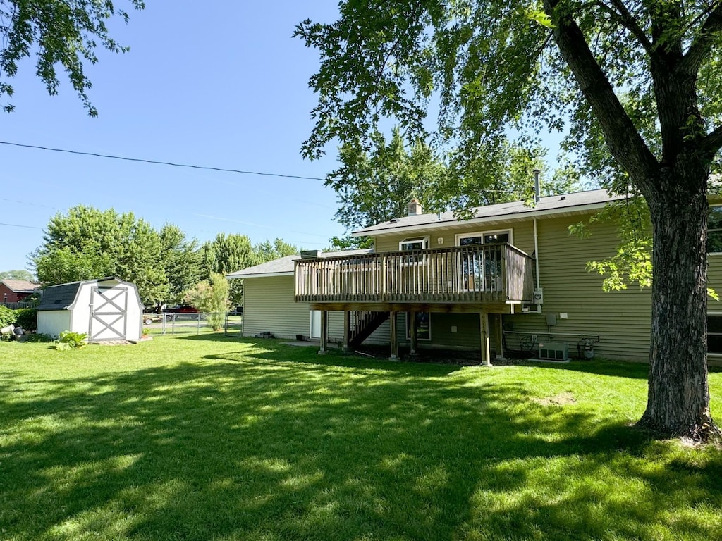 45 3rd Ave NW, Rice, MN 56367 - rear view of property with a deck, a storage shed, and stairway